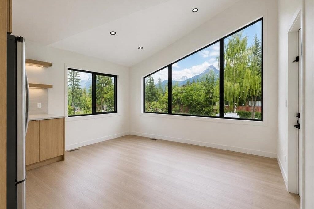 Living area with large windows and mountain views